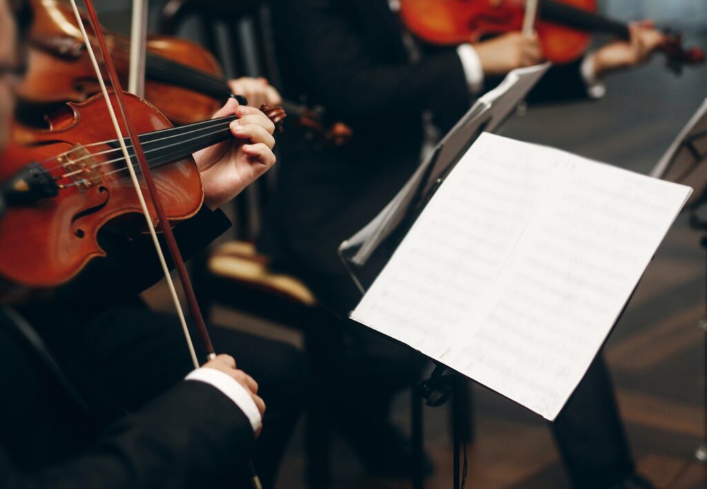 Elegant string quartet performing at wedding reception in restaurant