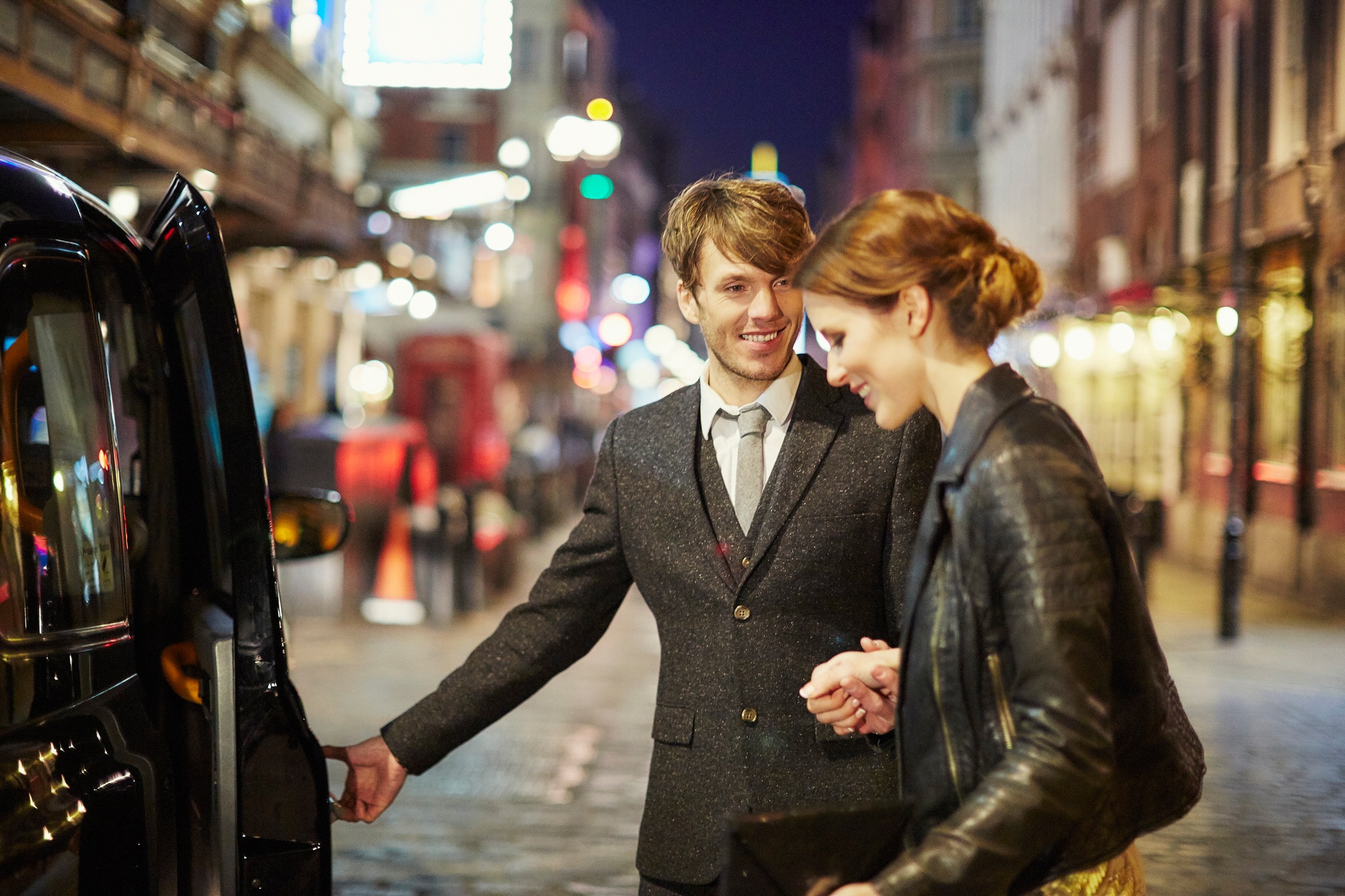 A couple enjoys a night out in the city