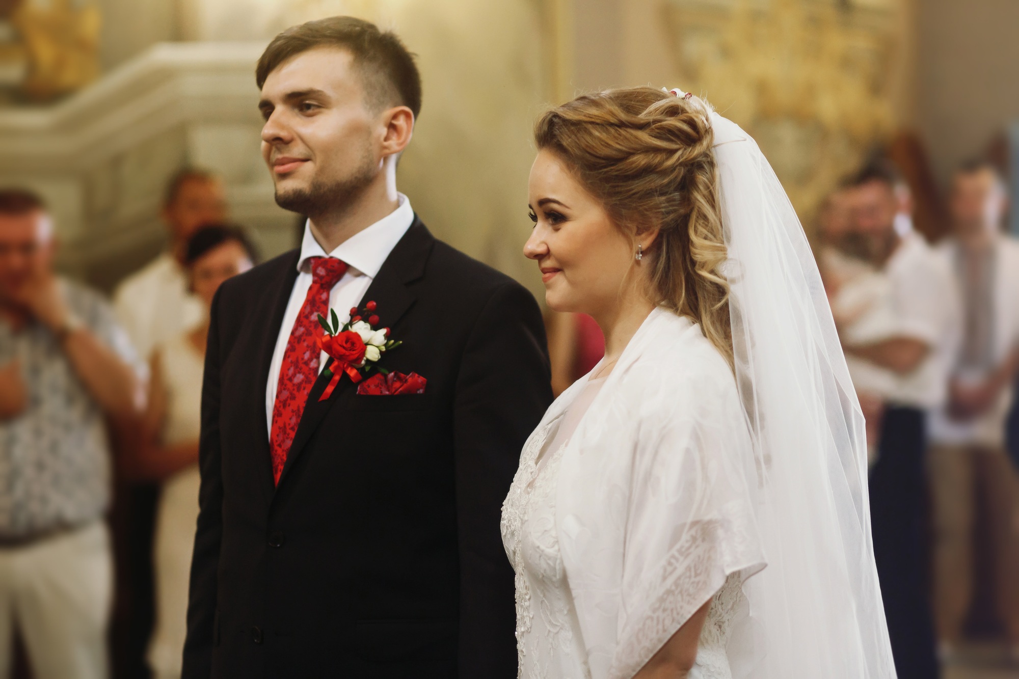 groom and bride in church during wedding ceremony,