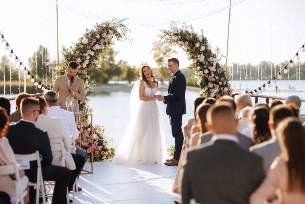 wedding ceremony on a high pier near the river